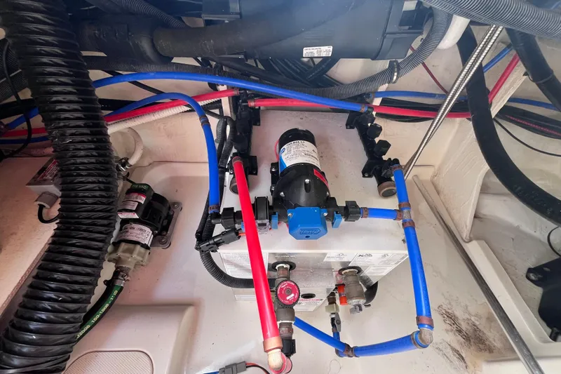 Blu Yacht Photos Pics Engine compartment of 2020 Sea Ray Sundancer 320 Outboard with visible wiring and components.