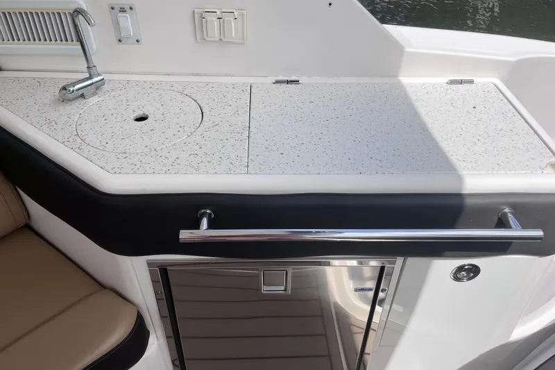 Blu Yacht Photos Pics 2020 Sea Ray Sundancer 320 Outboard boat kitchenette with sink and countertop.