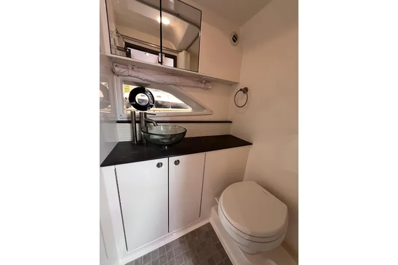 Blu Yacht Photos Pics 2020 Sea Ray Sundancer 320 Outboard bathroom with modern sink and toilet.
