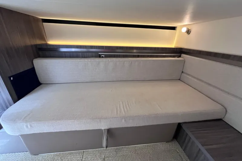 Blu Yacht Photos Pics 2020 Sea Ray Sundancer 320 Outboard interior cabin with cushioned seating and ambient lighting.