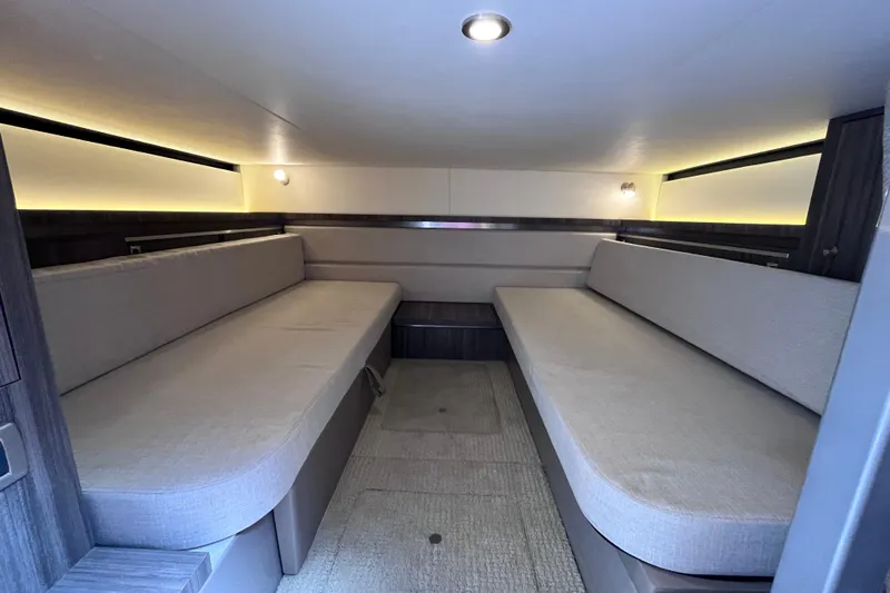 Blu Yacht Photos Pics 2020 Sea Ray Sundancer 320 Outboard cabin interior with modern seating and ambient lighting.