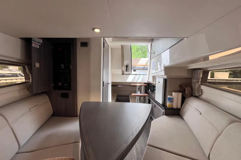 Blu Yacht Photos Pics Interior of 2020 Sea Ray Sundancer 320 Outboard, featuring cozy seating and modern amenities.