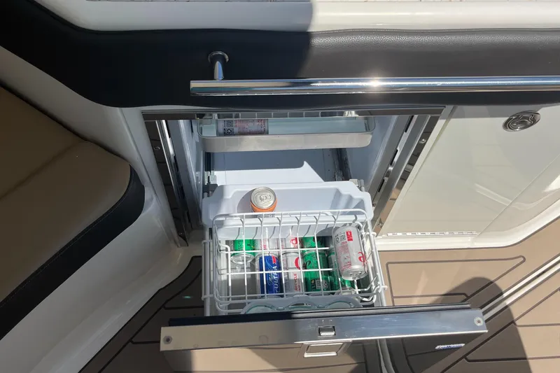 Blu Yacht Photos Pics Open drawer fridge on 2020 Sea Ray Sundancer 320 Outboard, stocked with beverages.
