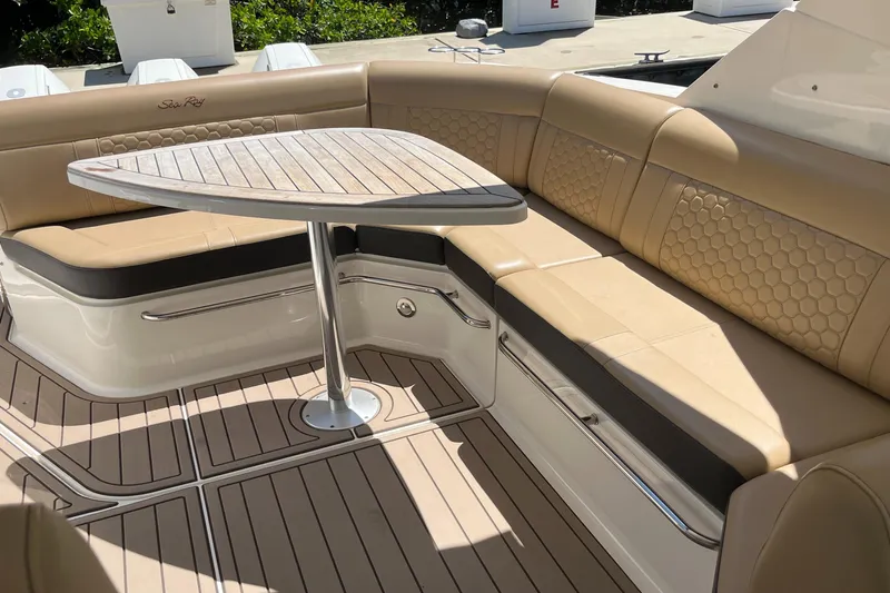 Blu Yacht Photos Pics Luxurious seating area on 2020 Sea Ray Sundancer 320 Outboard with elegant table and upholstery.