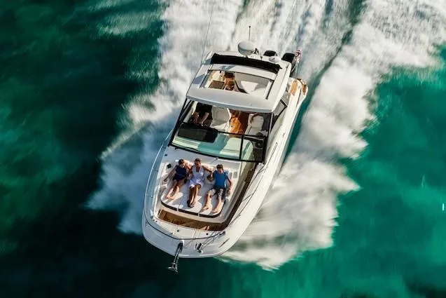 Blu Yacht Photos Pics Manufacturer Provided Image: 2020 Sea Ray Sundancer 320 OB cruising on clear turquoise waters.