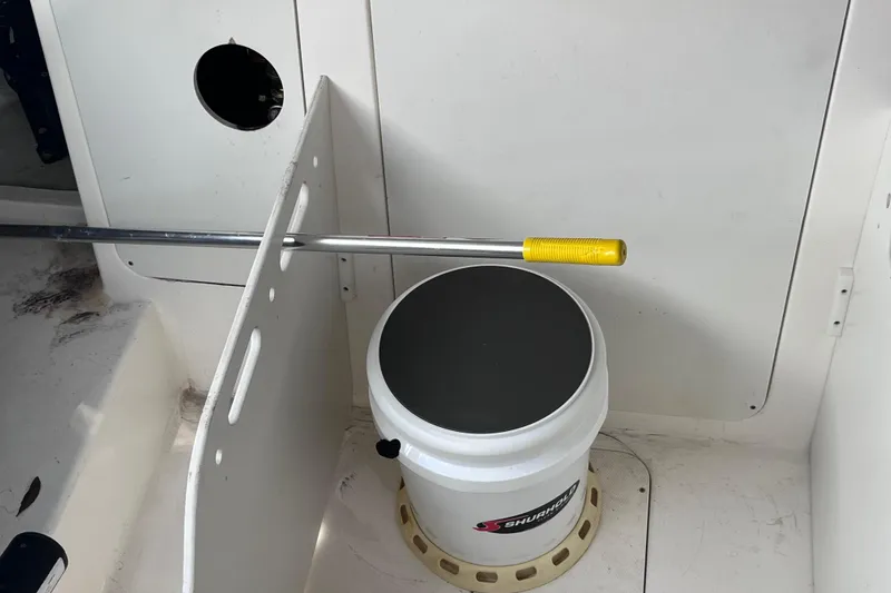 Blu Yacht Photos Pics 2020 Sea Ray Sundancer 320 Outboard interior with storage compartment and equipment.