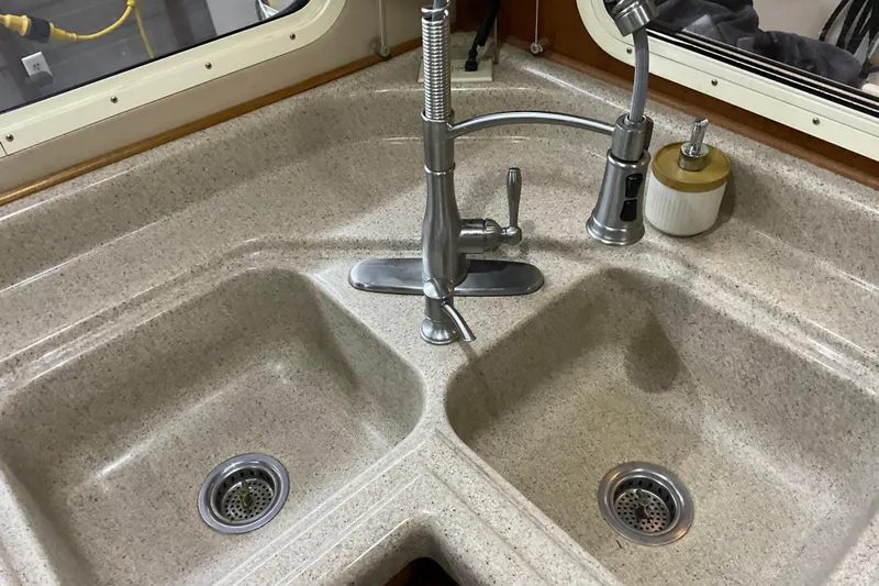 Hot Tuna Yacht Photos Pics Dual kitchen sink with modern faucet in 2002 American Tug Hull #24 boat.
