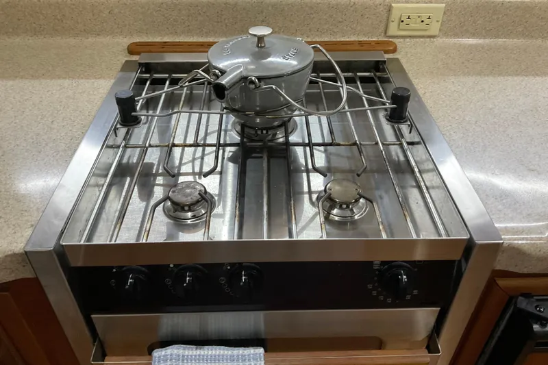 Hot Tuna Yacht Photos Pics Stainless steel stove with kettle on American Tug 2002, Hull #24.