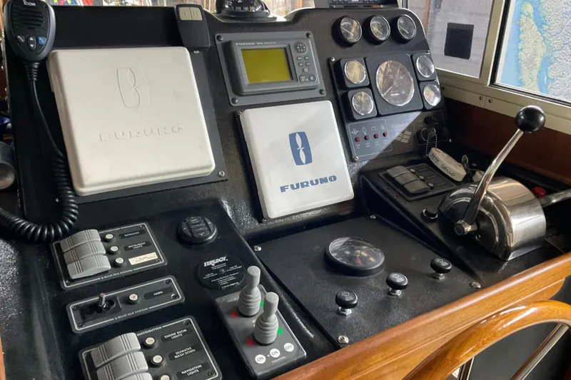 Hot Tuna Yacht Photos Pics Control panel of a 2002 American Tug Hull #24 with navigation and communication equipment.