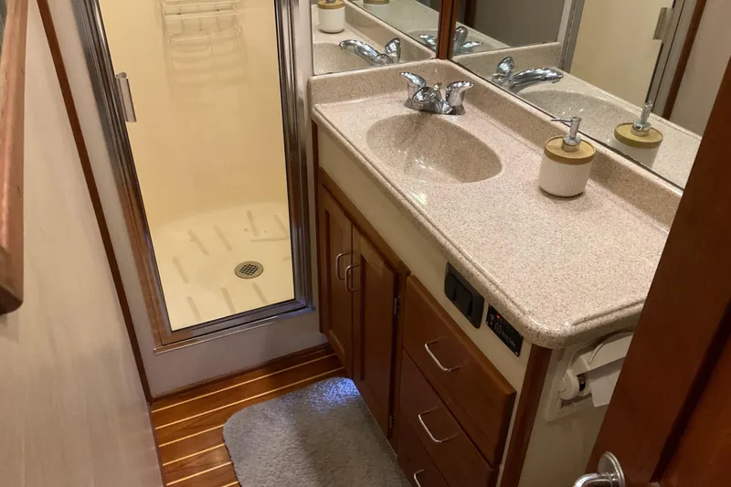 Hot Tuna Yacht Photos Pics Bathroom interior of 2002 American Tug Hull #24 with shower and vanity.