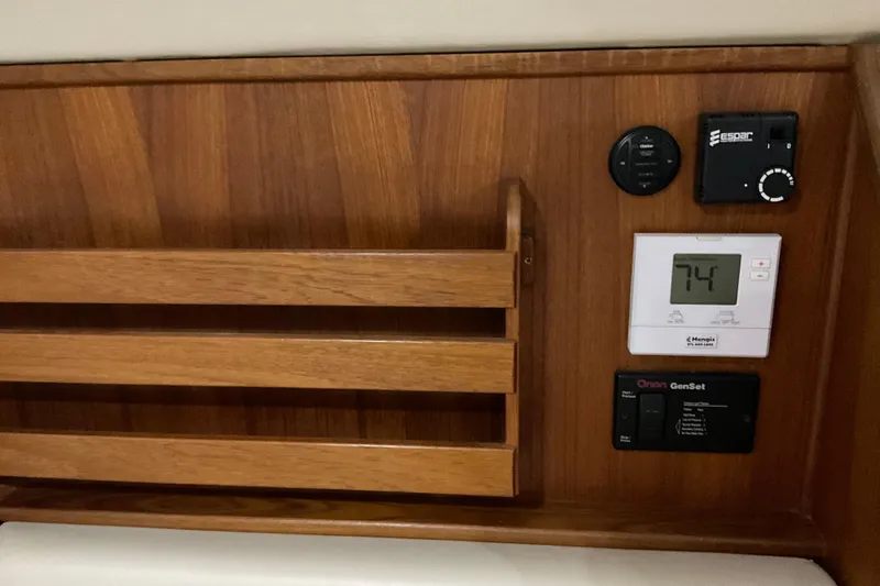Hot Tuna Yacht Photos Pics Wooden control panel on 2002 American Tug Hull #24 with thermostat and switches.