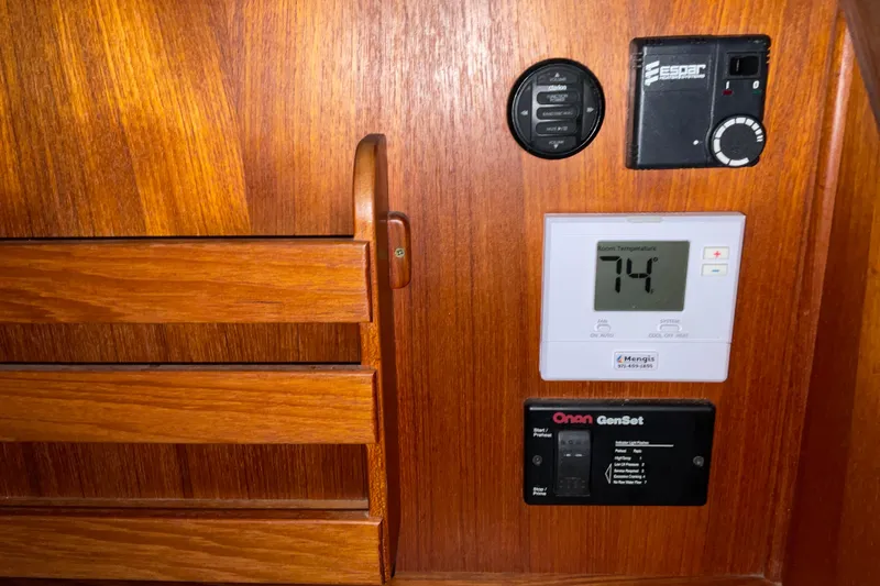 Hot Tuna Yacht Photos Pics Control panel on 2002 American Tug Hull #24 with temperature display and generator controls.