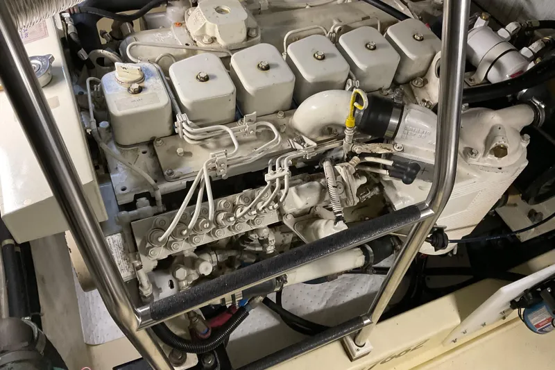 Hot Tuna Yacht Photos Pics Engine compartment of 2002 American Tug Hull #24, showcasing mechanical components and piping.