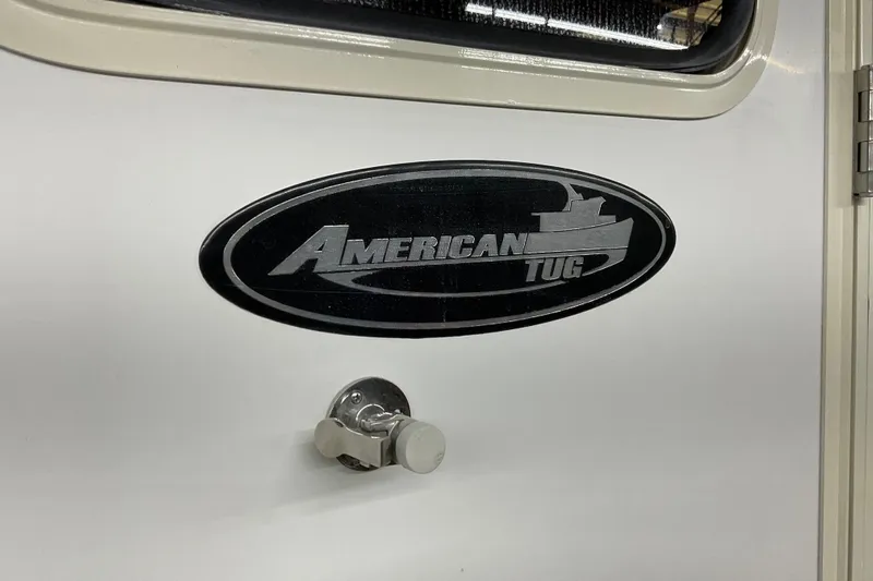 Hot Tuna Yacht Photos Pics American Tug Hull #24, 2002 model, logo on white surface.