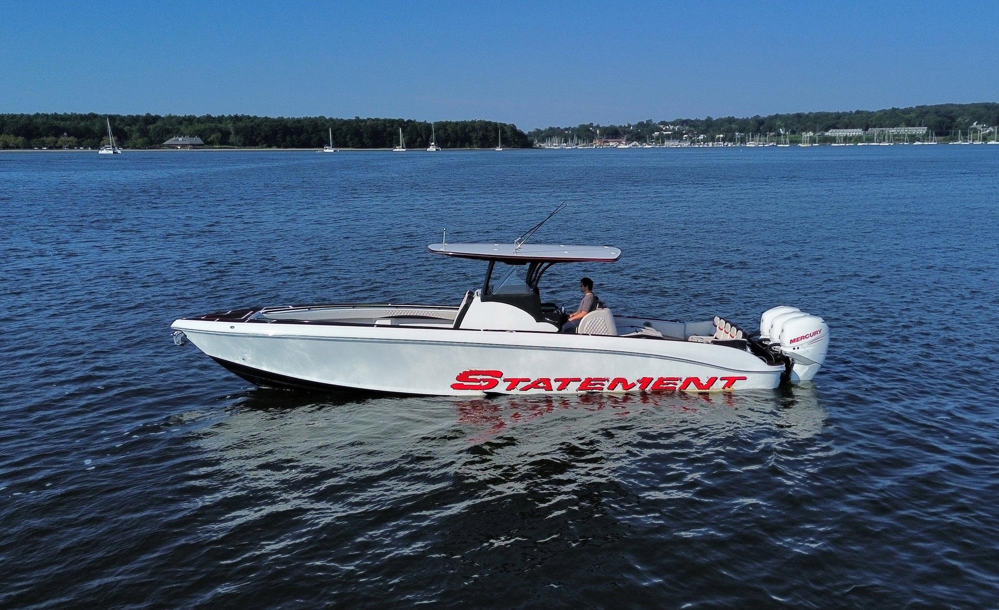 2017 Statement 380 Open boat on calm water with clear blue sky.