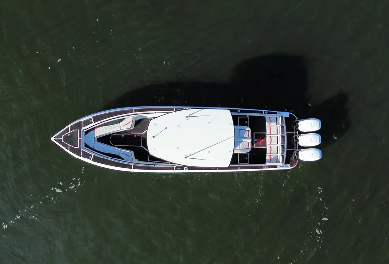 Heavy Metal Yacht Photos Pics Aerial view of 2017 Statement 380 Open boat on water.