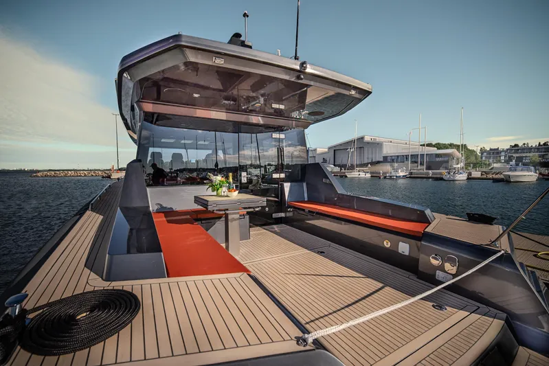 Explorer 1 Yacht Photos Pics Luxury Ridas 62 yacht, 2024 model, with spacious deck and modern design in a marina setting.