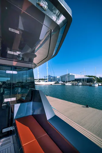 Explorer 1 Yacht Photos Pics 2024 Ridas 62 yacht docked at marina under clear blue sky.