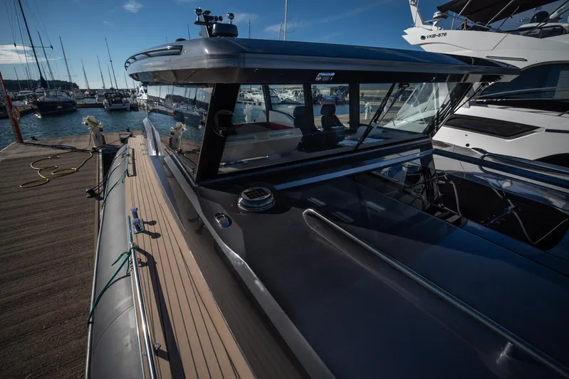 Explorer 1 Yacht Photos Pics 2024 Ridas 62 yacht docked at marina, showcasing sleek design and modern features.