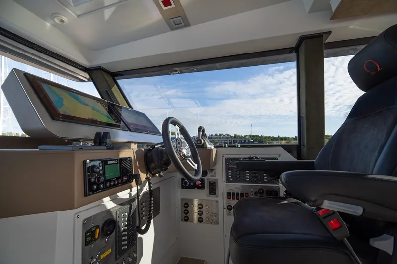 Explorer 1 Yacht Photos Pics Cockpit of 2024 Ridas 62 boat with modern navigation equipment and comfortable seating.