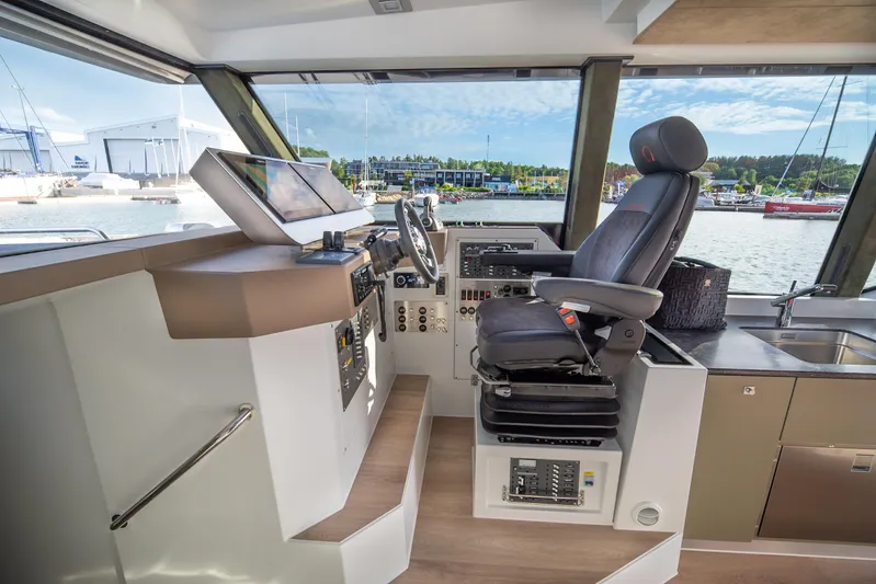 Explorer 1 Yacht Photos Pics 2024 Ridas 62 yacht interior helm with modern controls and panoramic windows.