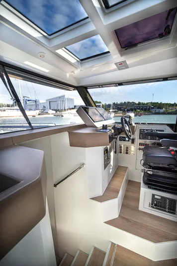 Explorer 1 Yacht Photos Pics Interior of 2024 Ridas 62 yacht with modern helm and panoramic windows.