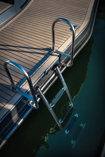 Explorer 1 Yacht Photos Pics Stainless steel boat ladder on Ridas 62, 2024 model, against wooden deck.