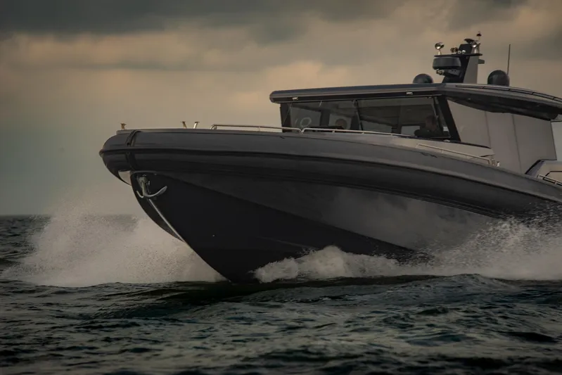 Explorer 1 Yacht Photos Pics 2024 Ridas 62 boat cruising on choppy waters under cloudy skies.