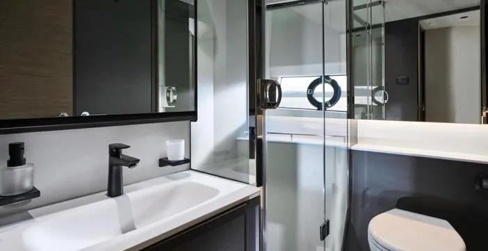 Yacht Photos Pics Luxurious bathroom in 2025 Princess S65 yacht, featuring modern fixtures and sleek design.