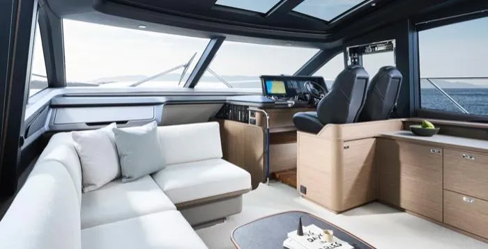  Yacht Photos Pics Luxurious interior of 2025 Princess S65 yacht with modern seating and navigation area.
