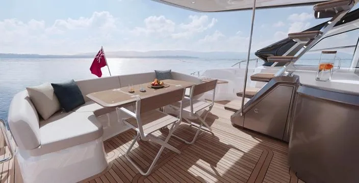  Yacht Photos Pics Luxurious 2025 Princess S65 yacht deck with elegant seating and dining area, overlooking serene waters.