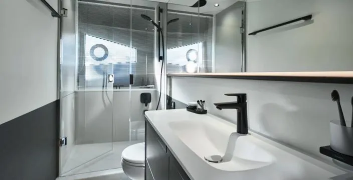  Yacht Photos Pics Modern bathroom interior on 2025 Princess S65 yacht, featuring sleek fixtures and glass shower.