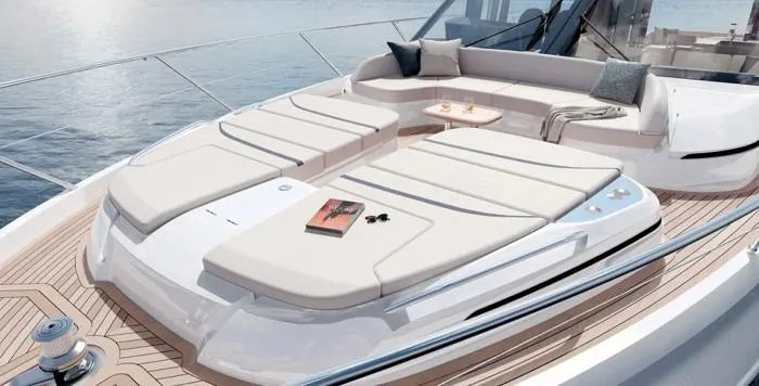  Yacht Photos Pics Luxurious 2025 Princess S65 yacht deck with sun loungers and elegant seating area.