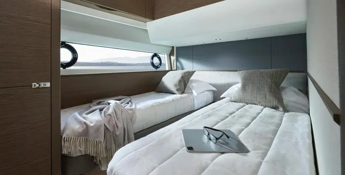  Yacht Photos Pics Luxurious cabin interior of 2025 Princess S65 yacht with twin beds and modern decor.