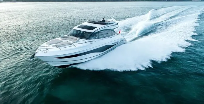  Yacht Photos Pics 2025 Princess S65 yacht cruising swiftly on open water.