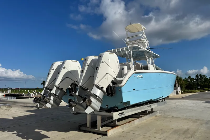  Yacht Photos Pics 2020 Invincible 40 Catamaran with dual outboard engines on a sunny day.