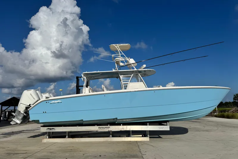  Yacht Photos Pics 2020 Invincible 40 Catamaran in light blue on a trailer under a clear sky.