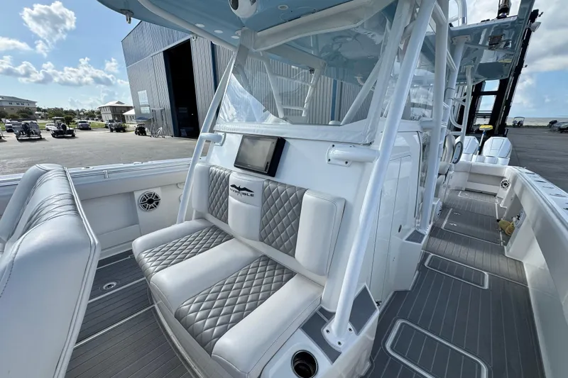  Yacht Photos Pics 2020 Invincible 40 Catamaran interior with cushioned seating and modern design.