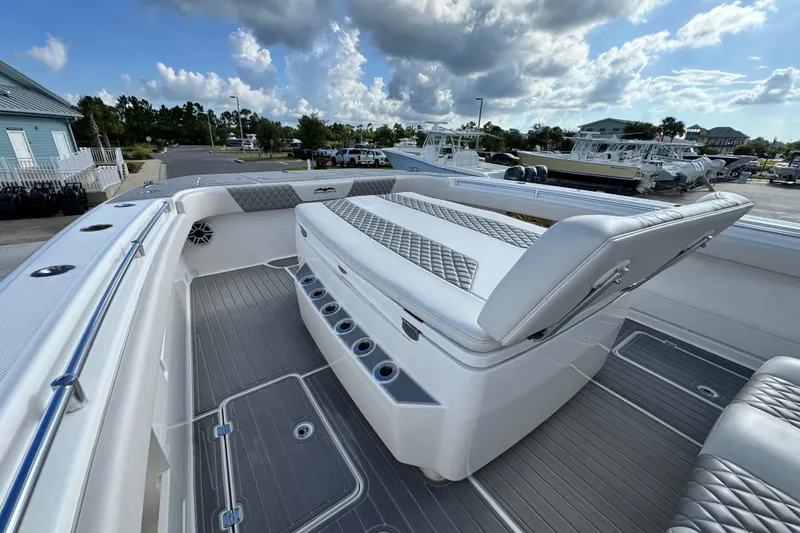  Yacht Photos Pics Invincible 40 Catamaran 2020 model with luxurious seating and sleek design under a cloudy sky.