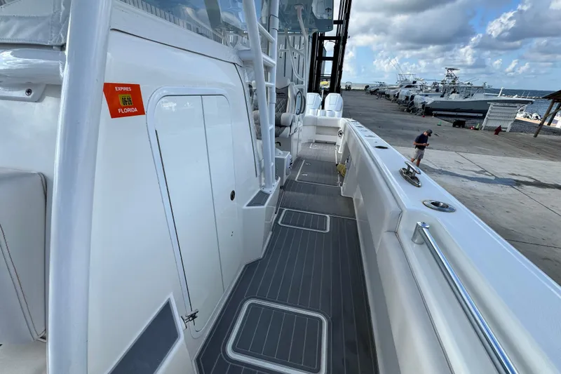  Yacht Photos Pics 2020 Invincible 40 Catamaran docked, showcasing sleek deck design and spacious layout.