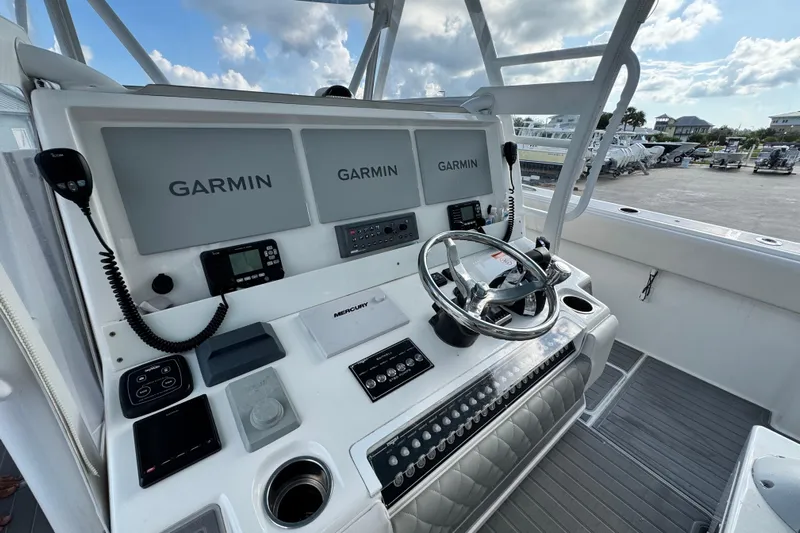  Yacht Photos Pics Helm of 2020 Invincible 40 Catamaran with Garmin displays and Mercury controls.