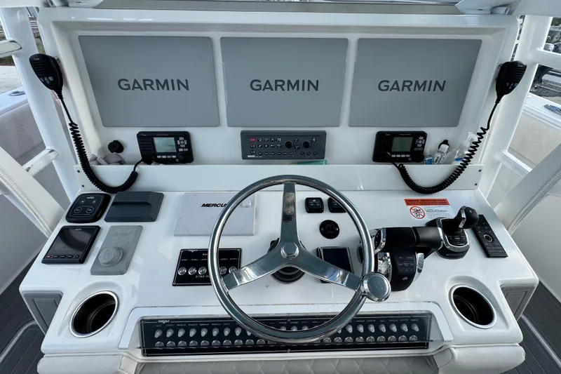  Yacht Photos Pics Control panel of 2020 Invincible 40 Catamaran with Garmin displays and steering wheel.