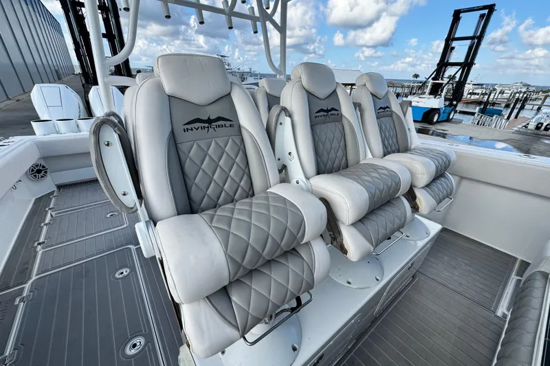  Yacht Photos Pics Luxury seating on 2020 Invincible 40 Catamaran, featuring quilted upholstery and sleek design.