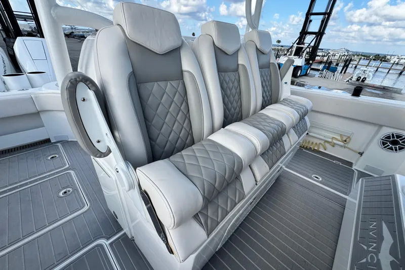  Yacht Photos Pics Luxurious seating on 2020 Invincible 40 Catamaran, featuring quilted upholstery and modern design.