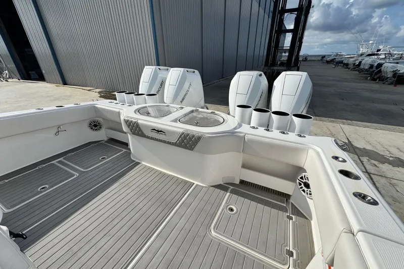  Yacht Photos Pics 2020 Invincible 40 Catamaran with Mercury engines, spacious deck, and fishing rod holders.
