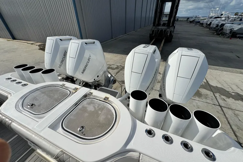  Yacht Photos Pics 2020 Invincible 40 Catamaran with Mercury outboard engines at a marina.