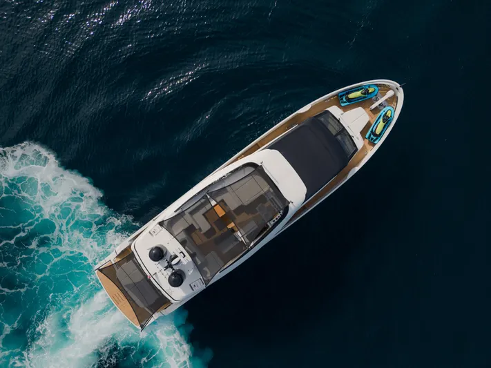 Mini K2 Yacht Photos Pics Aerial view of 2022 Extra X99 FAST yacht cruising on open water.