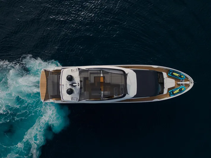 Mini K2 Yacht Photos Pics Aerial view of 2022 Extra X99 FAST yacht cruising on open water.