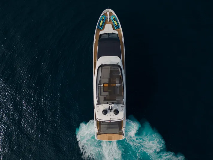 Mini K2 Yacht Photos Pics Aerial view of 2022 Extra X99 FAST yacht cruising on open water.