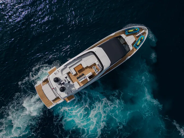 Mini K2 Yacht Photos Pics Aerial view of 2022 Extra X99 FAST yacht cruising in deep blue ocean.